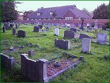 Sutton on Hull churchyard - looking towards the NW wall and the Church Hall . . click for a larger and clearer image of Pat Hughes' grave inscription.